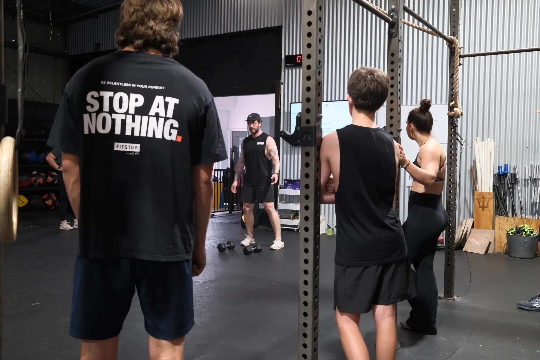 WITHIN members and coaches together on the gym floor